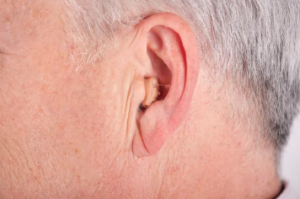 CIC Complete In Canal Hearing Aid Amplifier with human ear